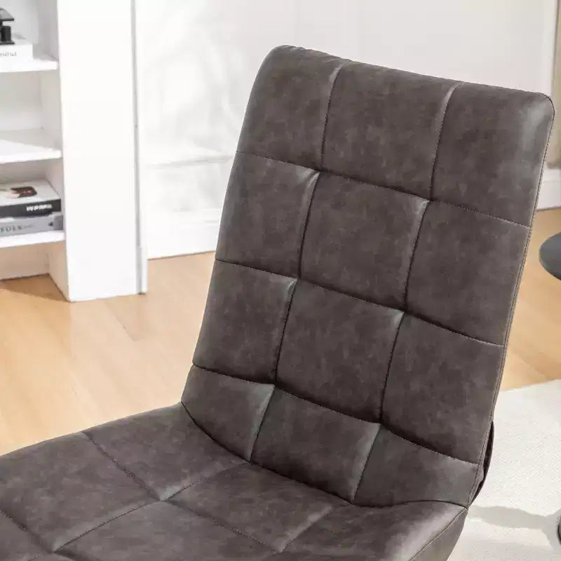 Silla de acento giratoria tapizada en cuero sintético capitoné